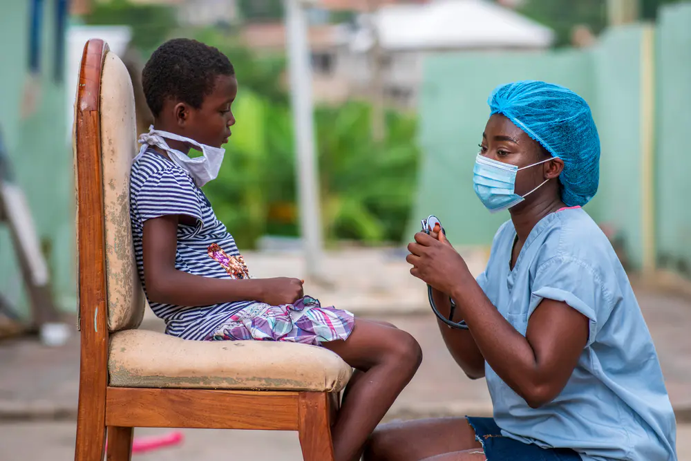 A doctor with a child during a medical consultation