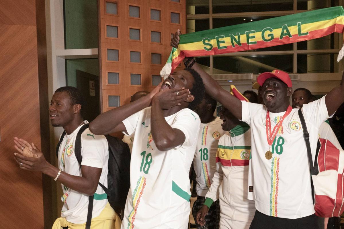 Senegalese football fans return home after royal pardon in Morocco