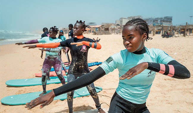 In Dakar, surf helps young girls return to school, inspiring pride