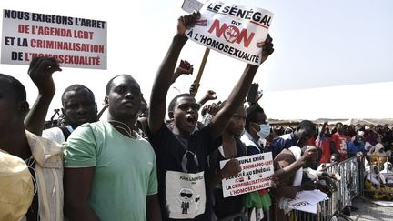 protesters holding signs during a demonstration in Dakar in february 2022