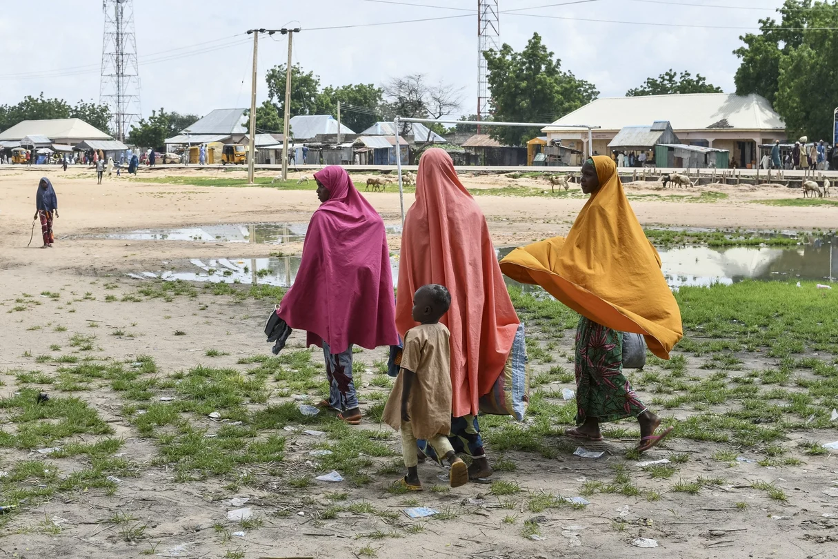 Survivors and relatives of victims of a suspected Boko Haram attack walk in Babban Gide on September 4, 2024. At least 81 people died and several remain missing after an assault carried out by suspected Boko Haram jihadists in Yobe State, northeastern Nigeria, local officials reported on September 3, 2024. About 150 suspected Boko Haram terrorists, armed with rifles and rocket launchers, struck Mafa district in over 50 motorcycles around 4 p.m. on Sunday, stated Abdulkarim Dungus, Yobe State police spokesperson.