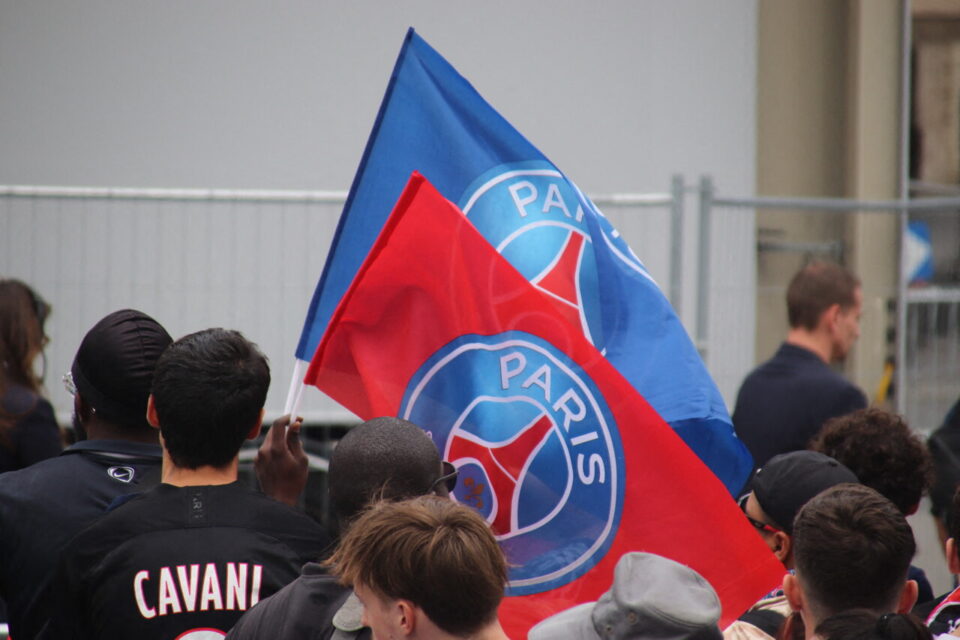 PSG players celebrating on the Champs-Élysées after a previous Champions League victory