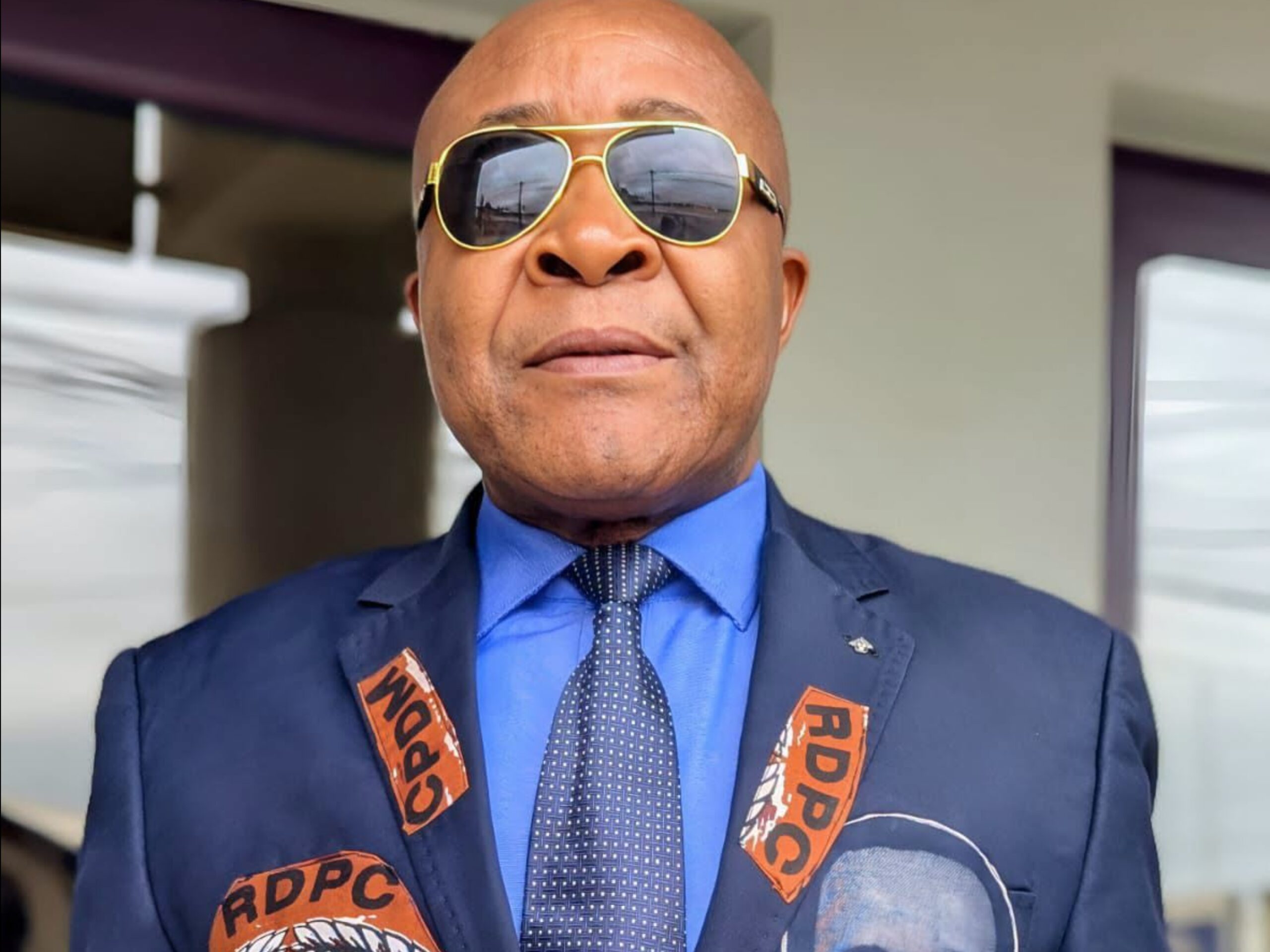 Cameroon professor attacked at douala airport defends unyielding support for president biya