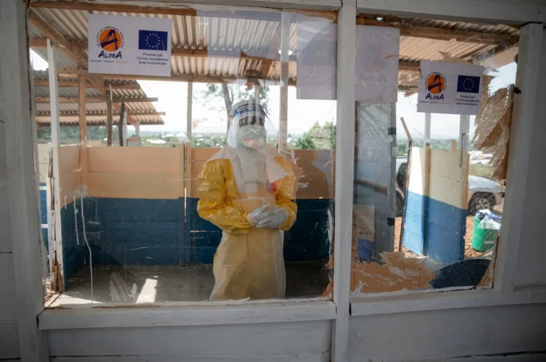 Health workers in protective gear responding to Ebola outbreak